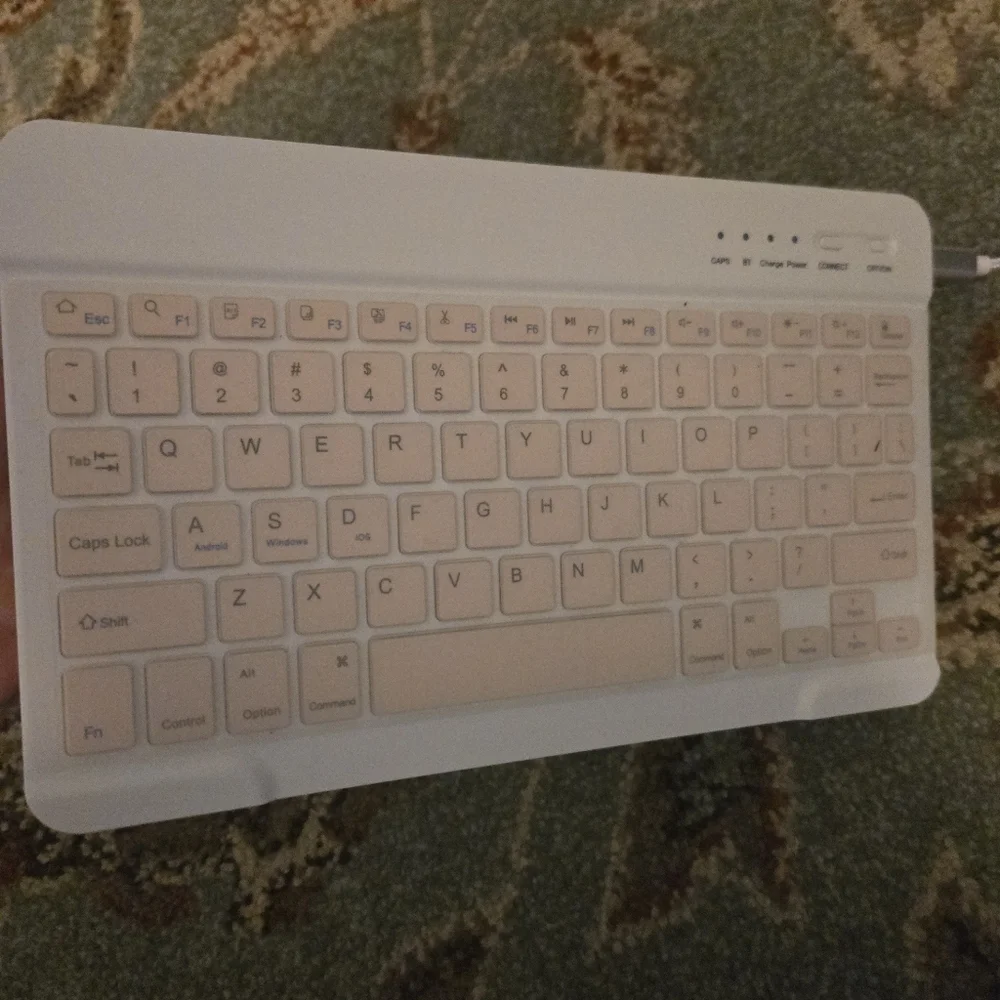 Bluetooth Keuboard For Cell Phones Or Tablets Comes With USB Cord Pink And White